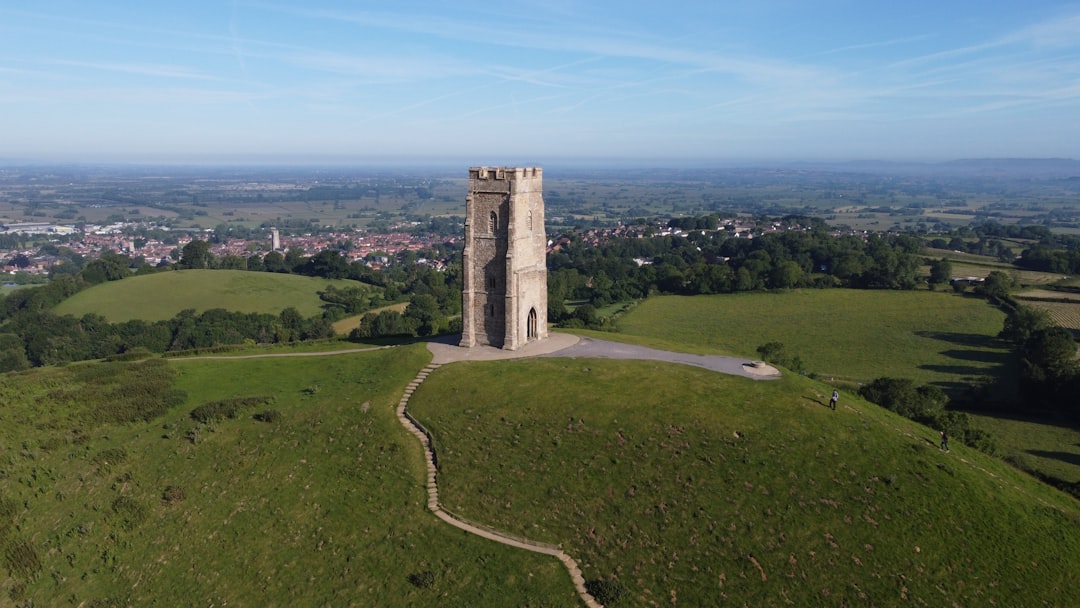An aerial view of a tower on a hill